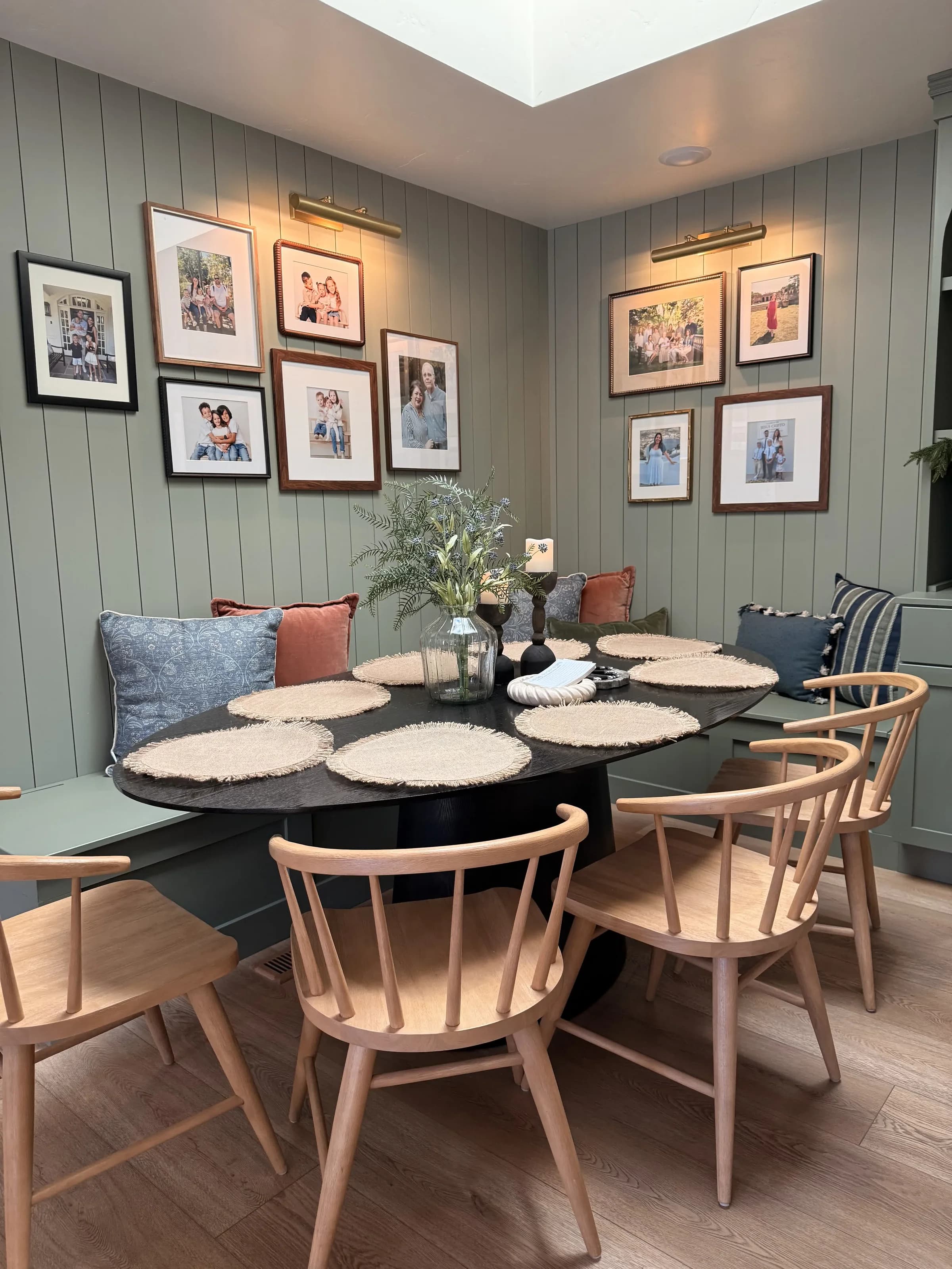 Dining nook with sage green shiplap walls by BK Toolbox