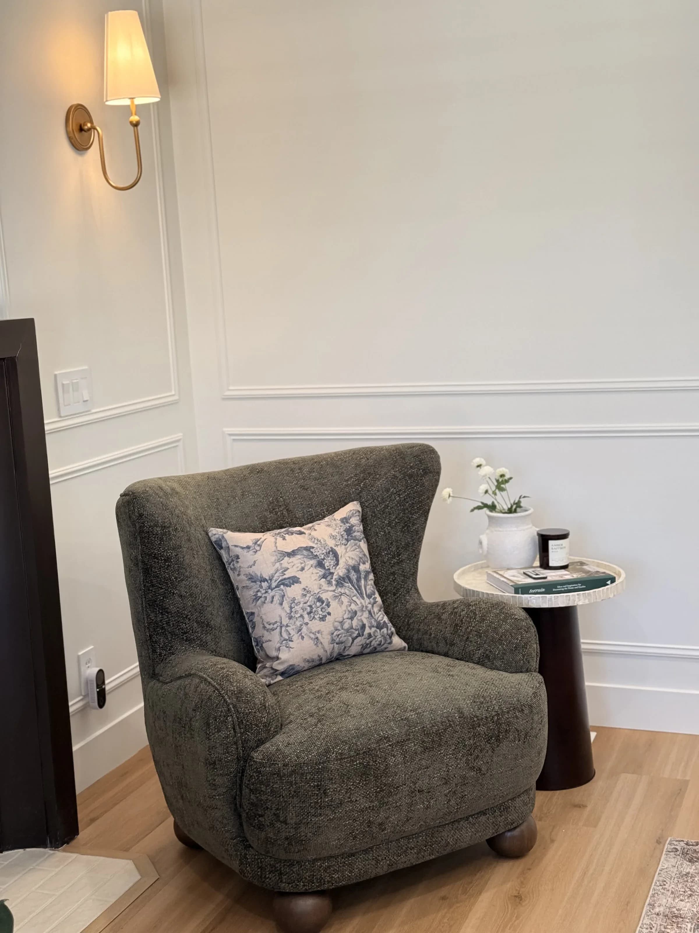Reading nook with wingback chair and panel molding