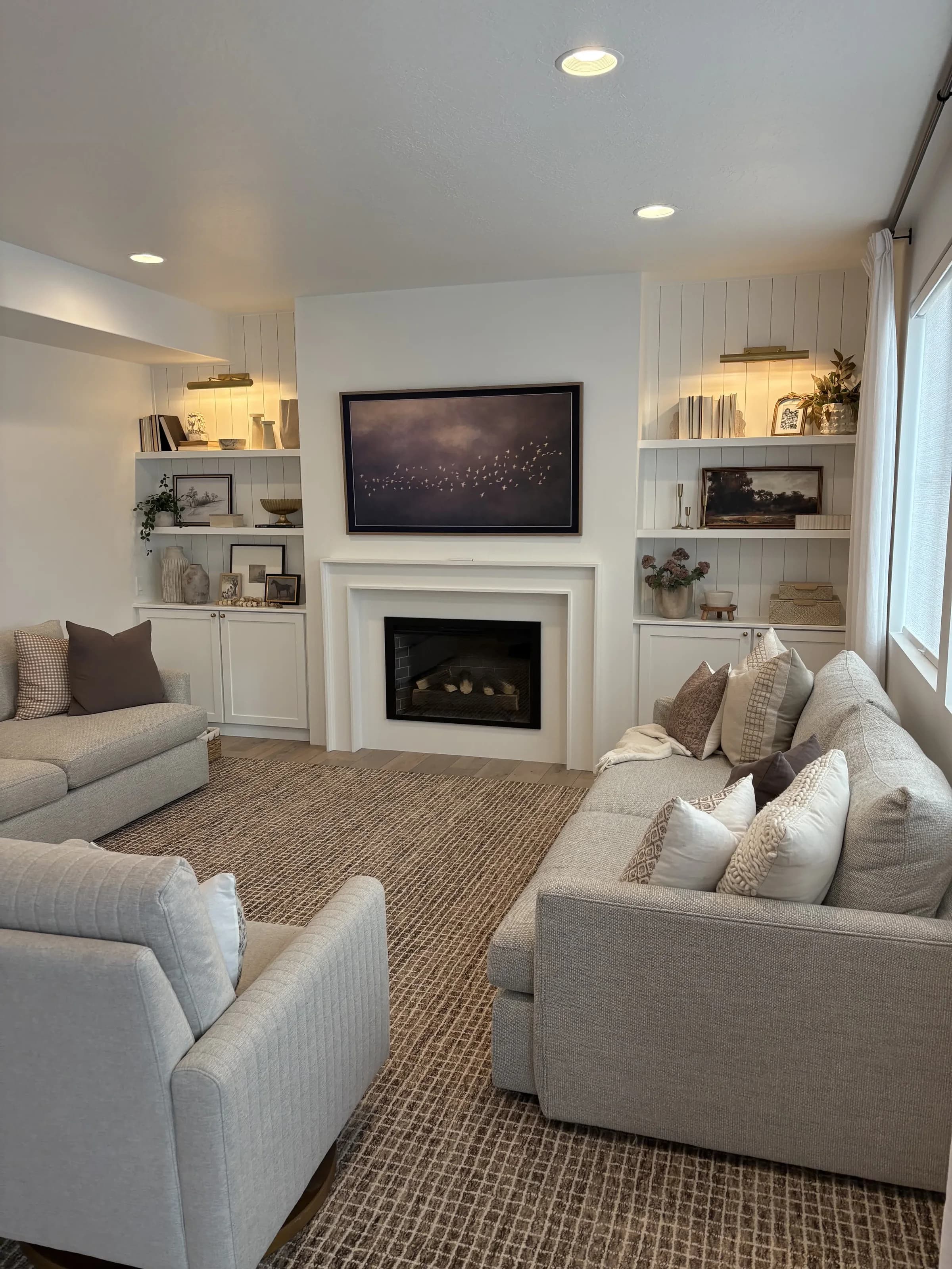 Living room with custom fireplace built-ins by BK Toolbox