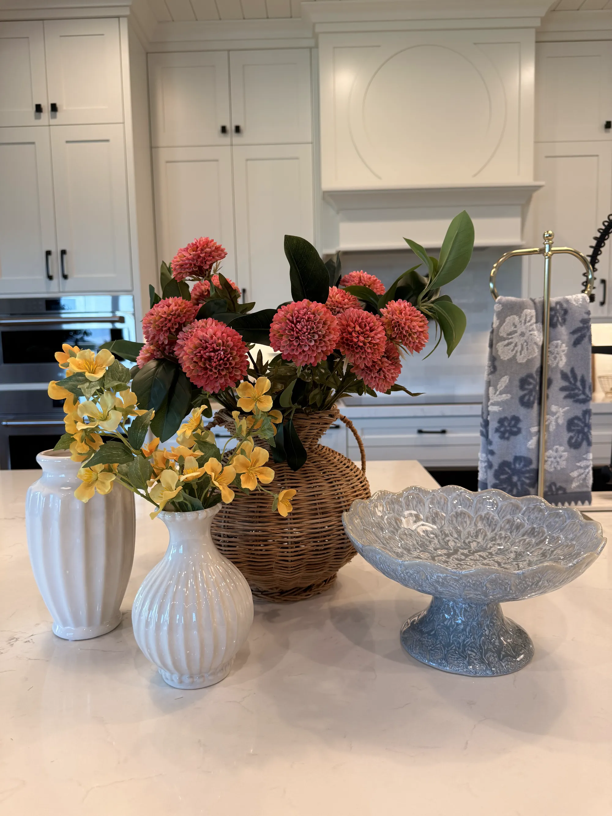Kitchen island styled with florals and ceramics by BK Toolbox